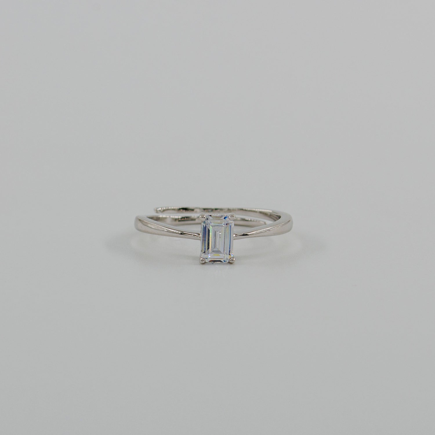 Saway 925 sterling silver ring with a vertical baguette-cut stone and slender band on a white background.